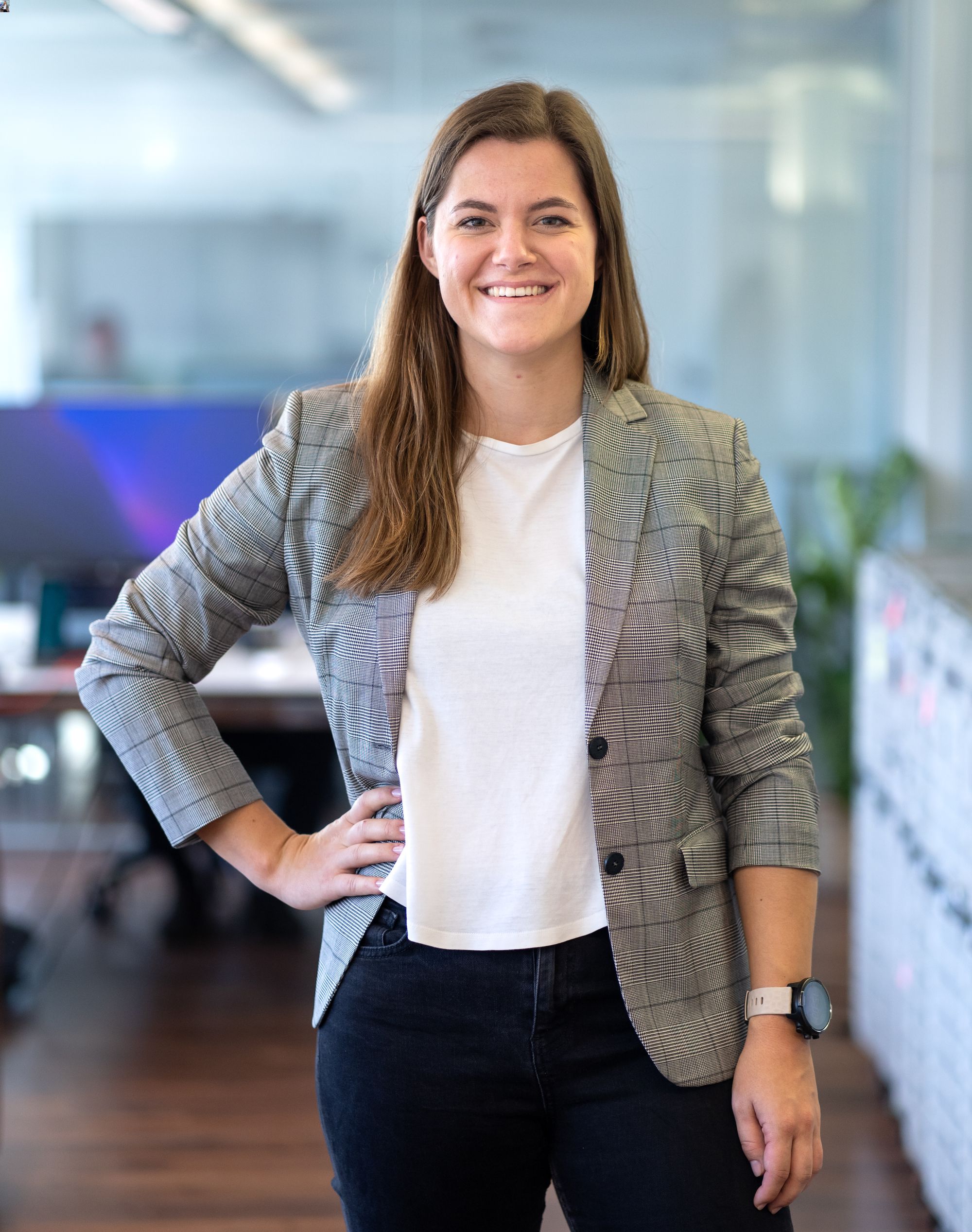 picture of Anna Eggenberger standing in an office with a blurred background